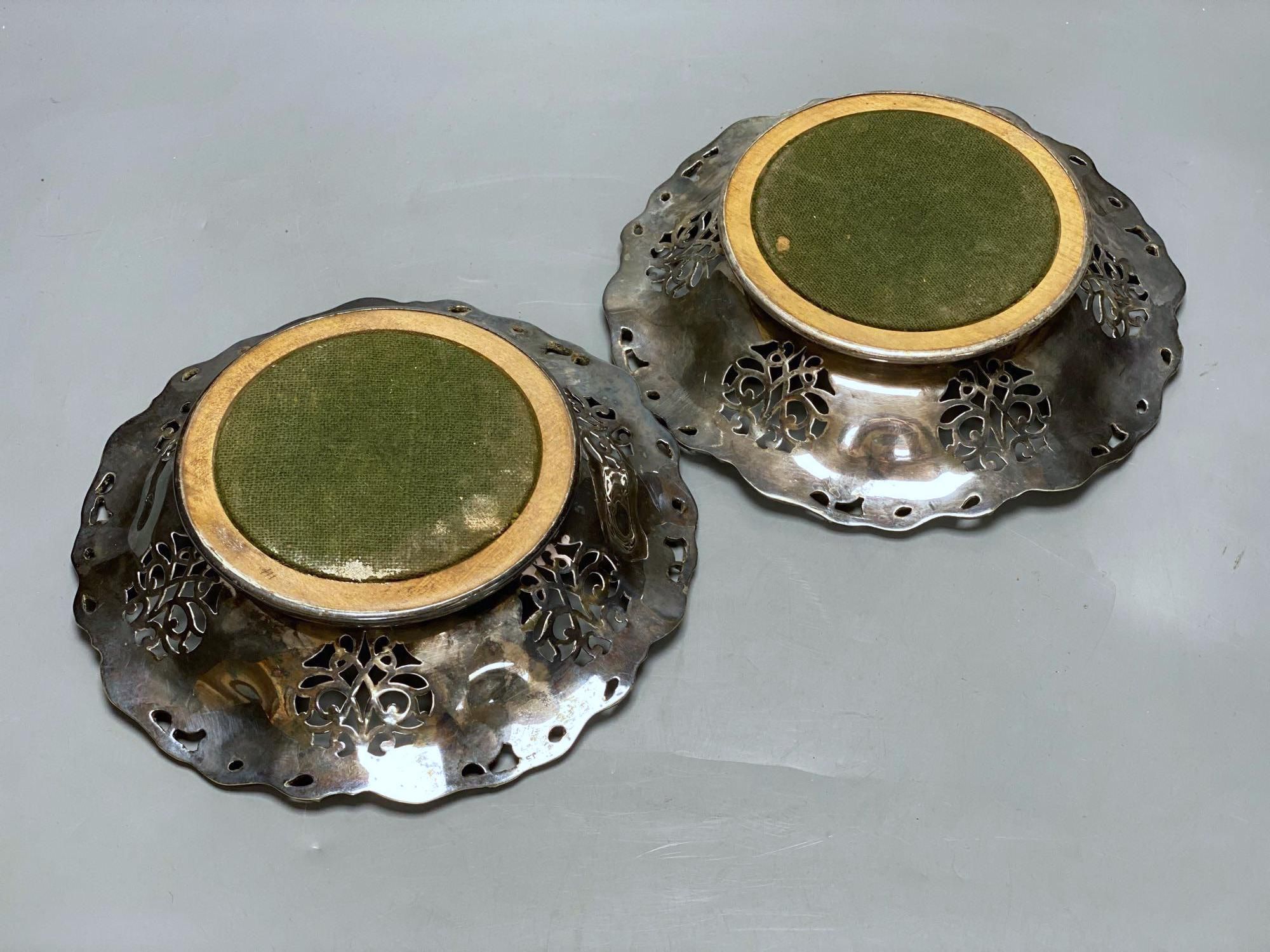 A pair of Victorian silver plated wine coasters, 20cm